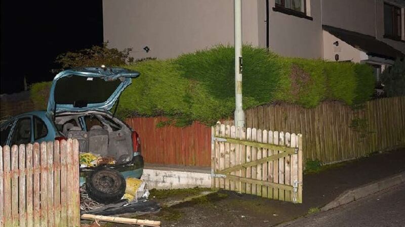 A handout picture released by the Police Service of Northern Ireland (PSNI) ishows a Command Wire Initiated Improvised Explosive Device, discovered in a vehicle in a residential area, during a search operation in the Creggan area.