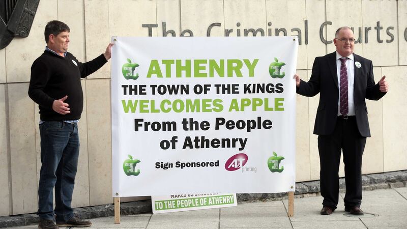 Athenry residents Martin Fergus and Kevin Higgins show their support for Apple’s planned data centre in Athenry outside the Criminal Courts of Justice. Photograph: Collins Courts