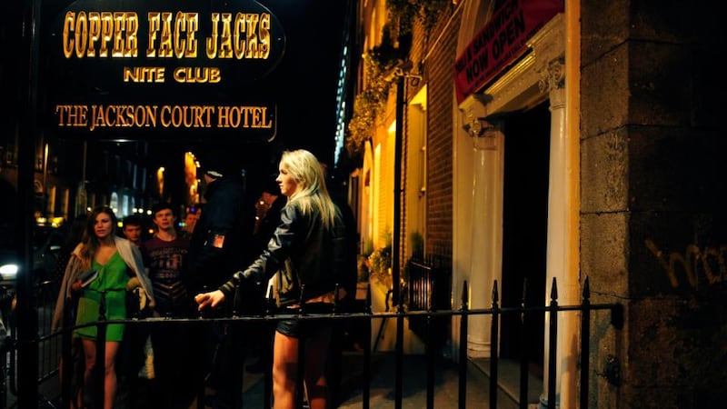 On the floor: dancing and queuing at Copper Face Jacks night club on Harcourt Street, in Dublin, this week. Photograph: Aidan Crawley