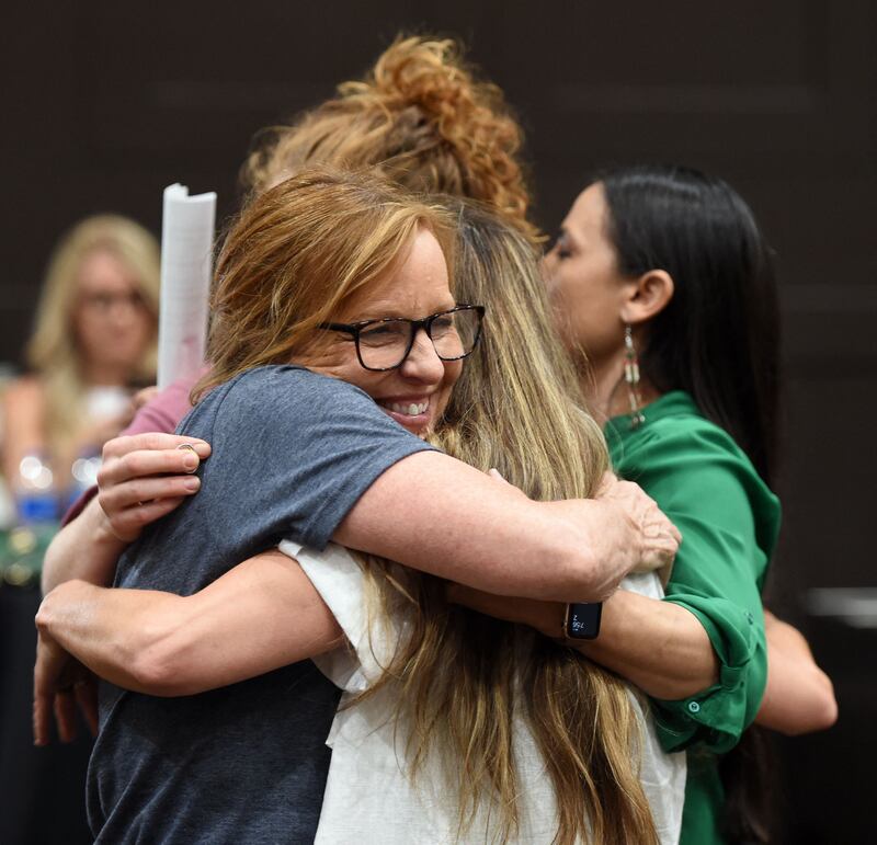 Representative Sharice Davids shares a group hug during the pro-choice Kansas for Constitutional Freedom primary election watch party in Overland Park, Kansas. Photograph: Dave Kaup/AFP via Getty Images