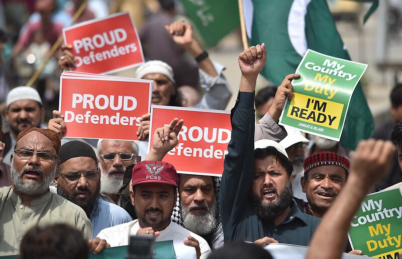 Supporters of the Islamic political party Jamaat-e-Islami hold national flags and placards during a protest after India launched missile strikes in Pakistan, in Karachi, Pakistan. Photograph: Shutterstock