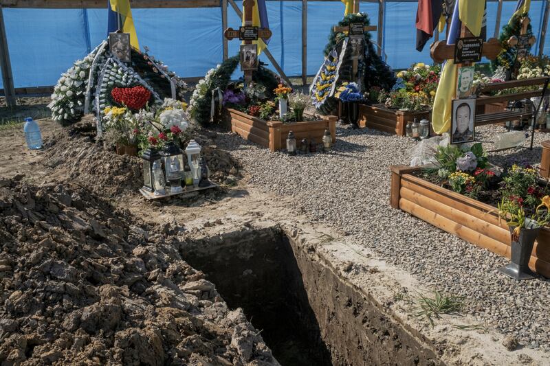 An open grave in the military section of a cemetery in Ivano-Frankivsk, western Ukraine in July, 2023. Photograph: Mauricio Lima/New York Times
                      