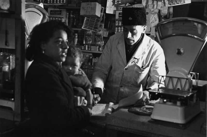 People in a shop in Tiger Bay, Cardiff in April 1950. Photograph: Bert Hardy/Picture Post/Hulton Archive/Getty Images