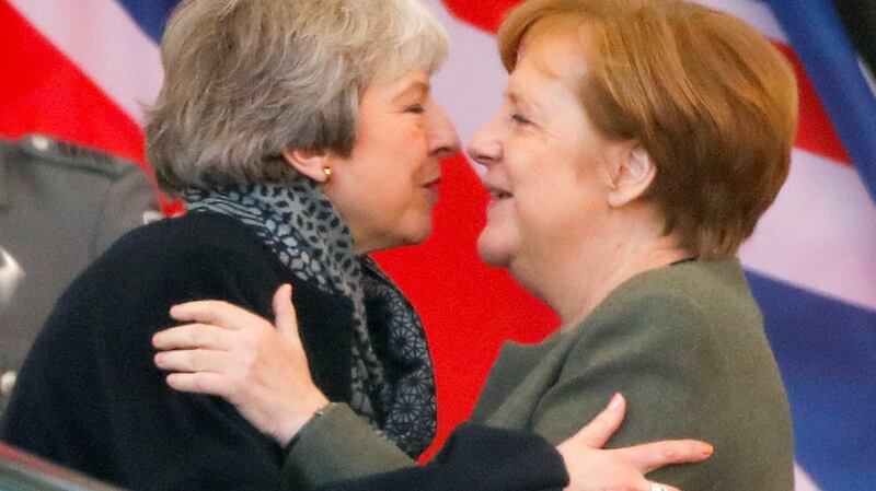 German chancellor Angela Merkel kisses British prime minister Theresa May as she leaves after they met to discuss Brexit at the chancellery in Berlin. Photograph: Hannibal Hanschke/Reuters