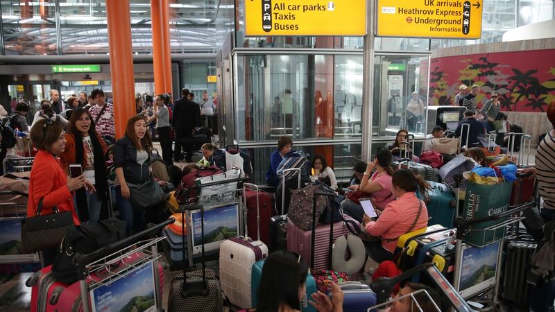 Travellers wait stranded at Heathrow Airport Terminal 5 after British Airways flights where cancelled at Heathrow Airport. Photograph: Daniel Leal-Olivas/AFP/Getty Images