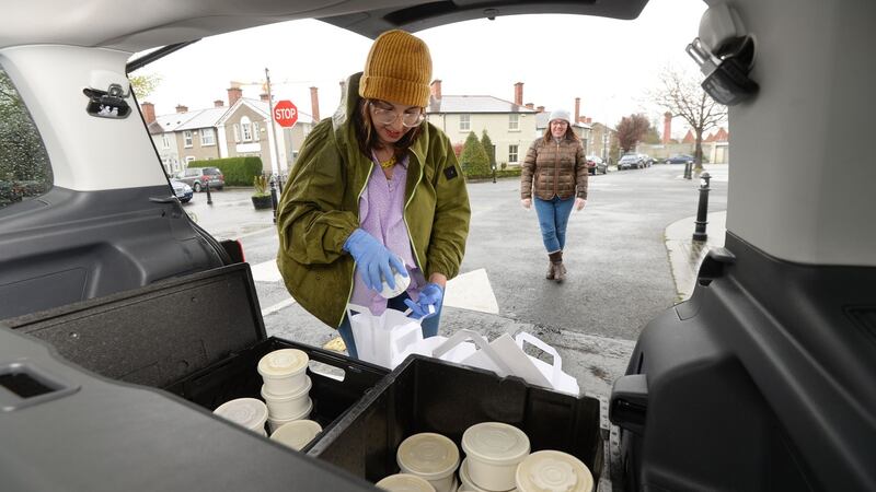 Hanan Swan  and volunteer Jen Coonan preparing food for distribution to local residents in the Tenters area of Dublin city centre. Photograph: Alan Betson/The Irish Times