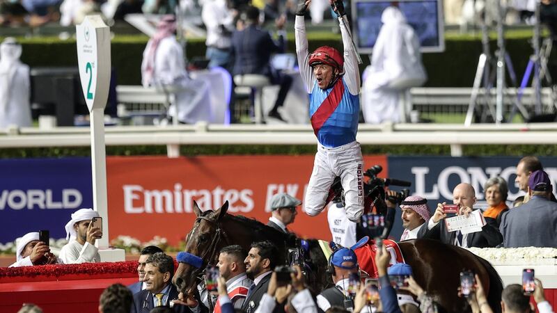 Frankie Dettori jumps from Country Grammer after victory in the $12 million  Dubai World Cup at the Meydan Racecourse. Photograph: Mahmoud Khaled/Getty Images