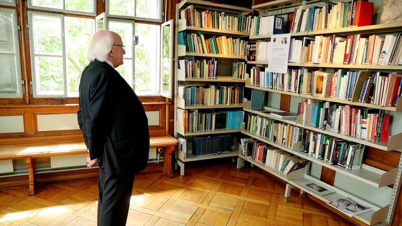 President Michael D Higgins examines a book collection at the James Joyce Foundation in Zurich, Switzerland. Photograph: Maxwell’s.
