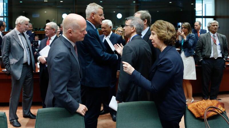 British foreign secretary William Hague listens to European Union foreign policy chief Catherine Ashton during an emergency EU foreign ministers meeting in Brussels yesterday. Photograph: Reuters/Francois Lenoir