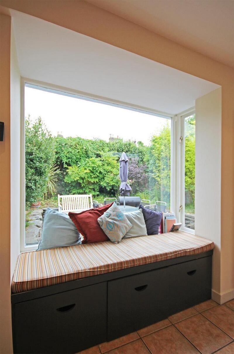 The open-plan kitchen/diningroom is made bright by a large box picture window with a deep window seat looking into the back garden