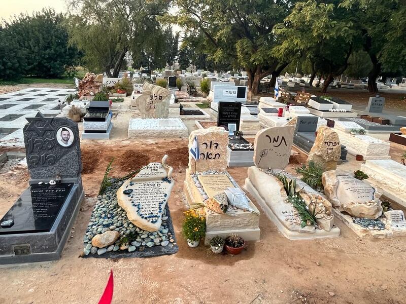 The graves of life-long best friends Ben Cohen, Dor Toar, Tamar Gutman, Eden Moshe and Yiftah Twig, all aged 27, who were killed in the Hamas-led attack on the Nova music festival in Israel on October 7th last. 