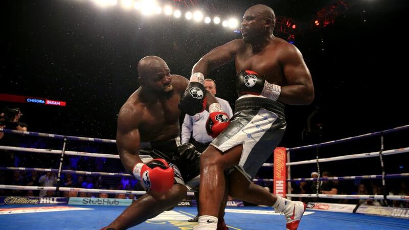 Dereck Chisora knocks down Carlos Takam during their heavyweight clash. Photograph: Ben Hoskins/Getty