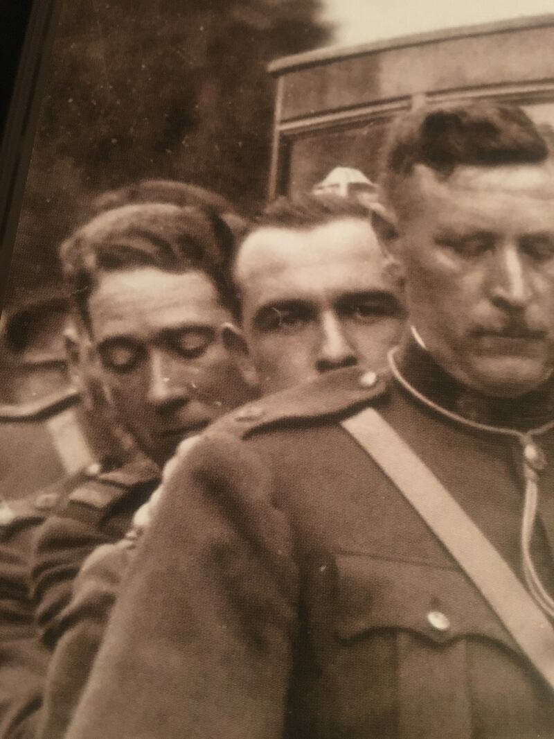Conor Brady's father, left, carries the coffin of Kevin O'Higgins