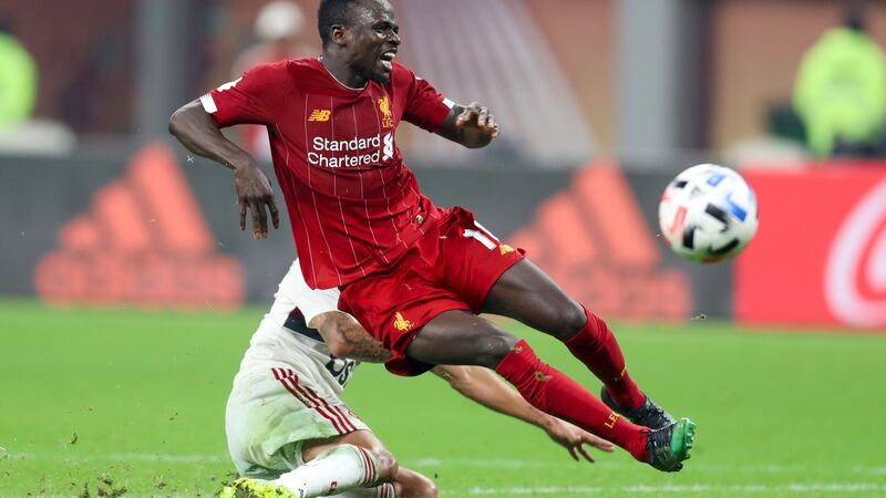 Flamengo defender Rafinha tackles Liverpool striker Sadio Mane during the  Fifa Club World Cup final at the Khalifa International Stadium in  Doha, Qatar. Photograph: Karim Jaafar/AFP via Getty Images