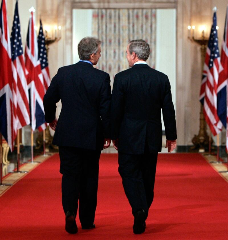 US president George W Bush (right) and British prime minister Tony Blair at the White House after speaking to reporters about Iraq in 2006. Photograph: Kevin Lamarque/Reuters