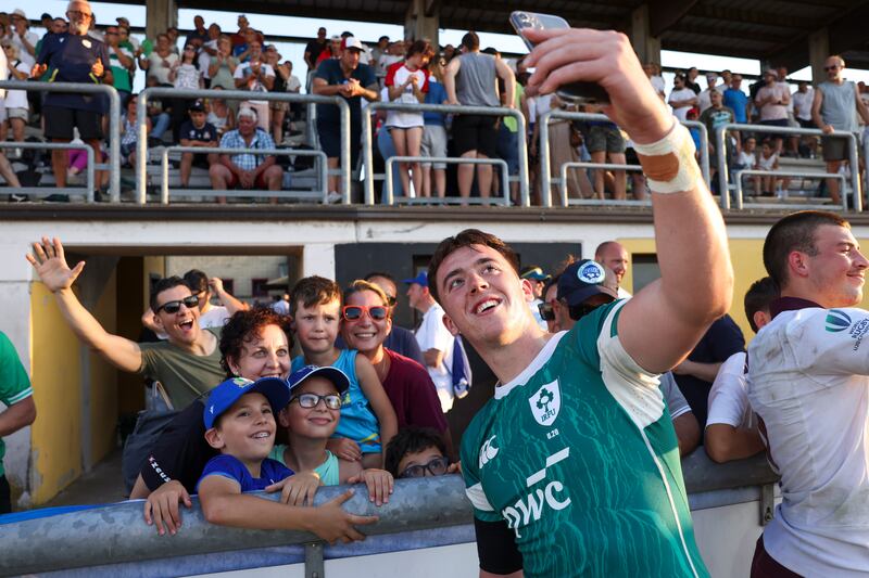 Ireland's Daniel Green and Ospreys' Harri Deaves celebrates after the match. Photograph: Sebastiano Pessina/Inpho