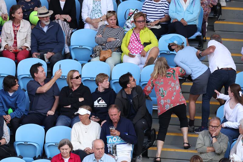 The protester is escorted out of the Margaret Court Arena. Photograph: Darrian Traynor/Getty Images