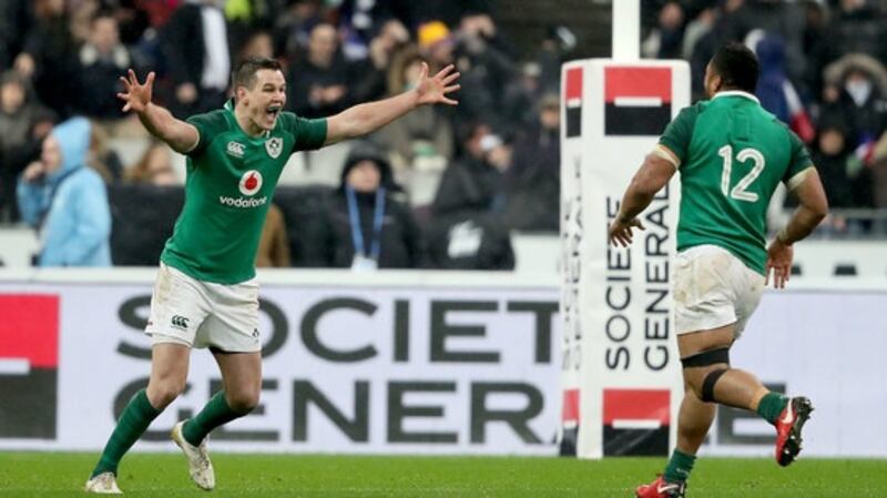 Ireland’s Johnny Sexton celebrates with team make Bundee Aki after kicking the winning drop goal. Photograph:James Crombie/Inpho