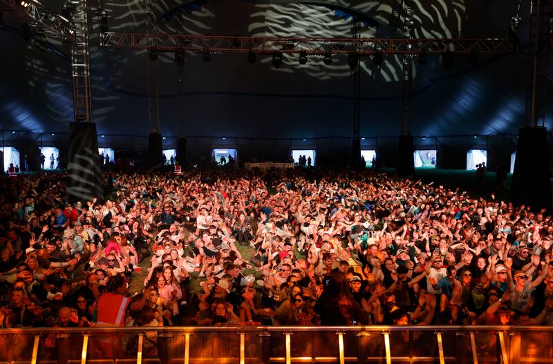 Electric Picnic 2024: thousands of early arrivals in the Terminus tent on Thursday for an attempt to set the Guinness World Record for the largest rock-the-boat dance, in support of Save Our Sons & Daughters, a mental-health and suicide-prevention charity. Photograph: Alan Betson