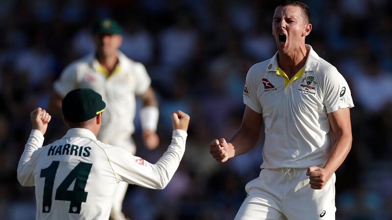 Josh Hazelwood celebrates taking the wicket of Joe Denly. Photograph: Ryan Pierse/Getty
