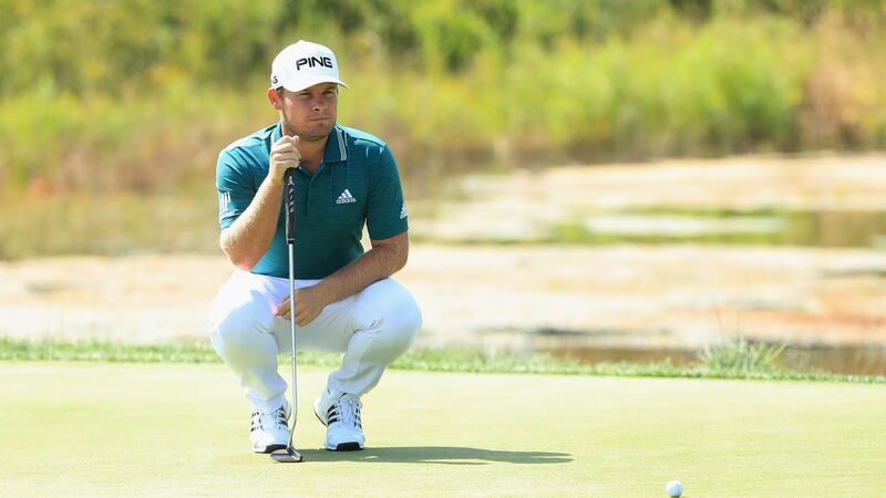 Hatton lines up a putt on the second green. Photo: Andrew Redington/Getty Images