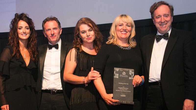 Lynn Lambe, Marketing Manager, Ecocem Ireland presents the Building of the Year award to the, McCauley Daye O’Connell Architects team.