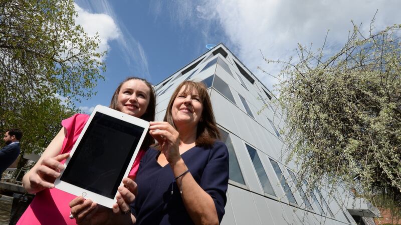 Joanne Walker of the web & app design team  and Evelyn Cusack, head of forecasting, both of   Met Éireann, launch the weather forecaster’s new website and app giving seven-day forecasts in local areas on Wednesday, as spring weather finally arrives in Dublin. Photograph: Alan Betson/The Irish Times