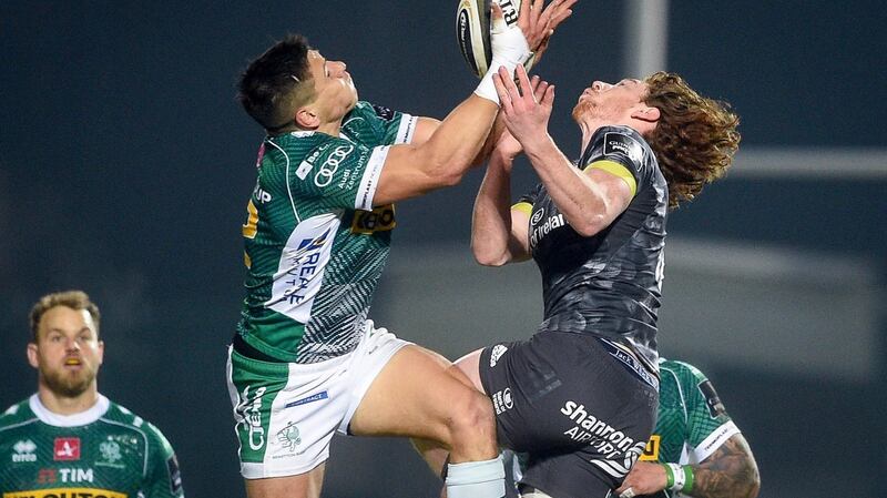 Juan-Ignacio Brex competes in the air with Ben Healy. Photo: Elena Barbini/Inpho