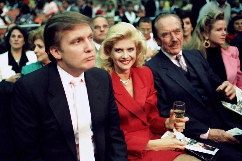Donald Trump with Ivana Trump and father, Fred Trump, at a Mike Tyson boxing match in 1988. Photograph: Jeffrey Asher/Getty