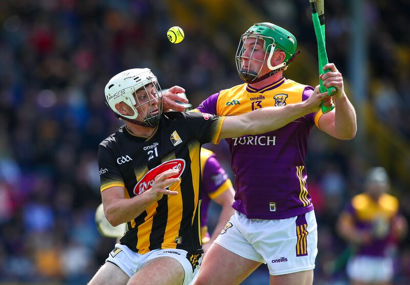 Kilkenny’s Cian Kenny and Wexford’s Kevin Foley fight for possession. Photograph: Ken Sutton/Inpho