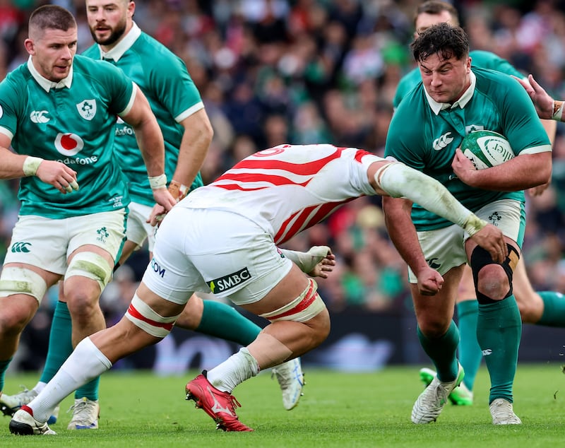 Ireland’s Thomas Clarkson is tackled by Japan’s Ben Gunter. Photograph: Billy Stickland/Inpho