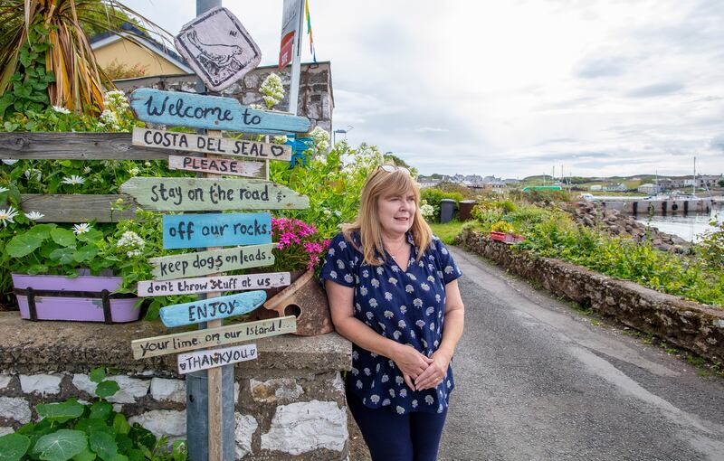 Artist Yvonne Braithwaite outside her shop on Rathlin Island. Photograph: Paul Faith