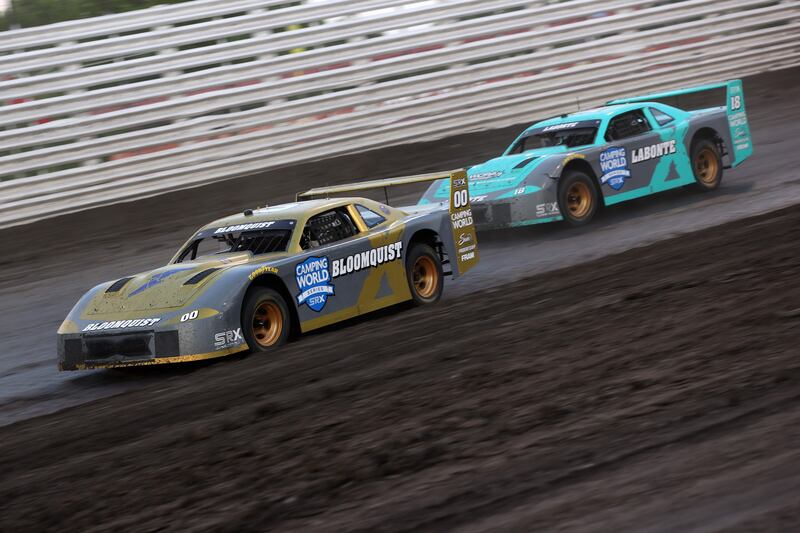 Scott Bloomquist leads Bobby Labonte at Knoxville Raceway in Iowa in June 2021. Photograph: Dylan Buell/SRX via Getty Images