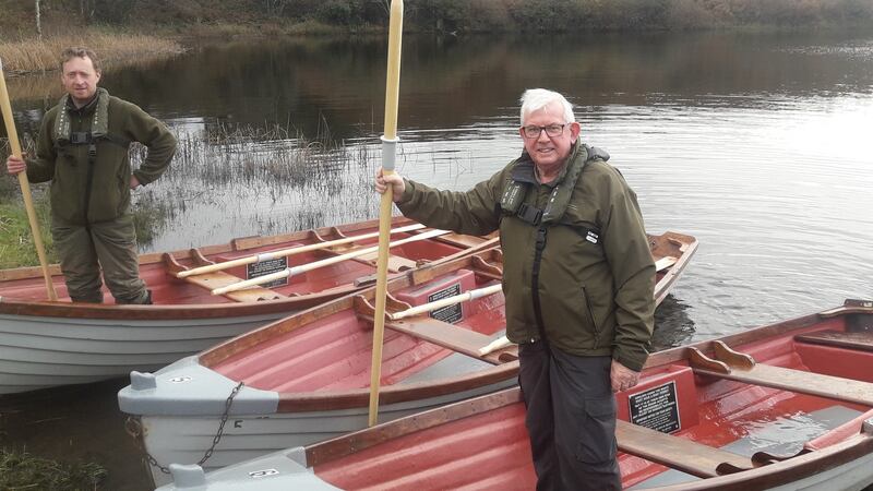 Local fisheries officers Martin Dennehy and Stephen O’Donoghue with recently refurbished 14ft ‘Anglers’ Fancy’ boats available for hire at Shepperton Lake in West Cork.