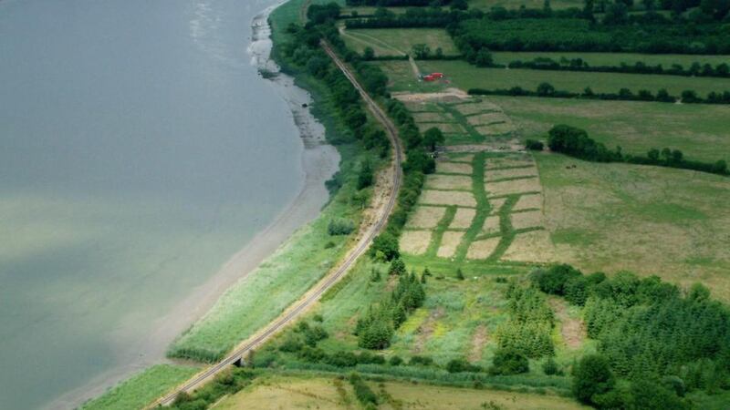 Settlement: the Viking base; the lines of new grass mark test trenches. photographs: Studio Lab/NRA