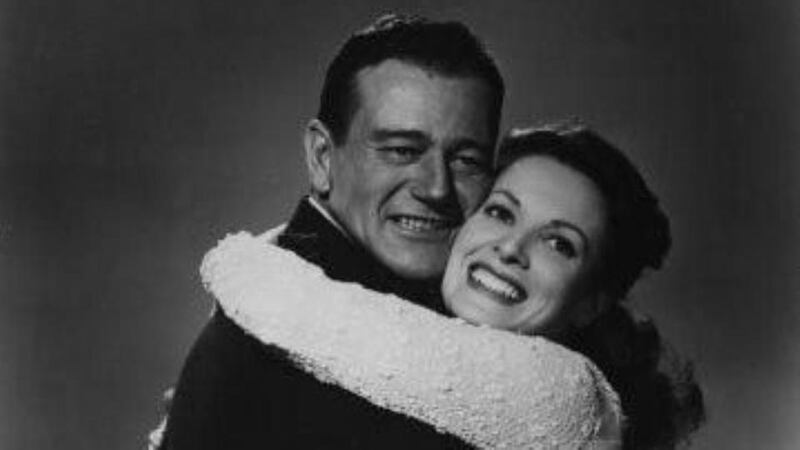 Maureen O’Hara with John Wayne in a publicity still for ‘The Quiet Man’.