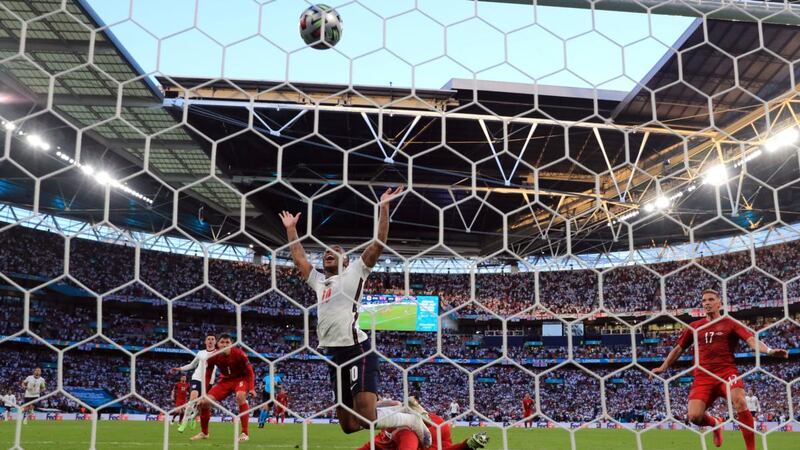 Denmark’s Simon Kjaer scores an own goal under pressure from England’s Raheem Sterling during the Euro 2020 semi-final at Wembley. Photograph: Nick Potts/PA Wire