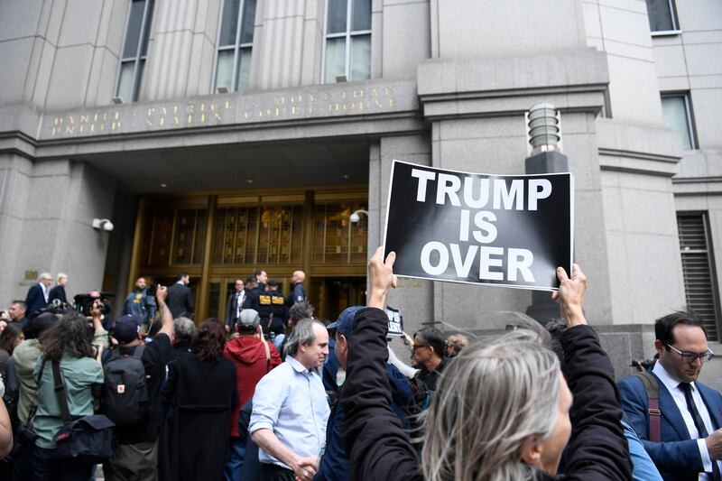 Protesters outside the federal courthouse after the verdict in E Jean Carroll’s lawsuit against Trump in lower Manhattan on Tuesday. Photograph: Brittainy Newman/The New York Times
                     