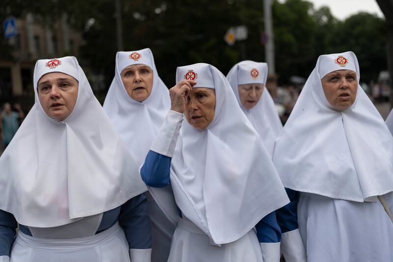 Nuns pray outside the Odesa Transfiguration Cathedral in Odesa following Russian missile attacks (Jae C. Hong/AP)