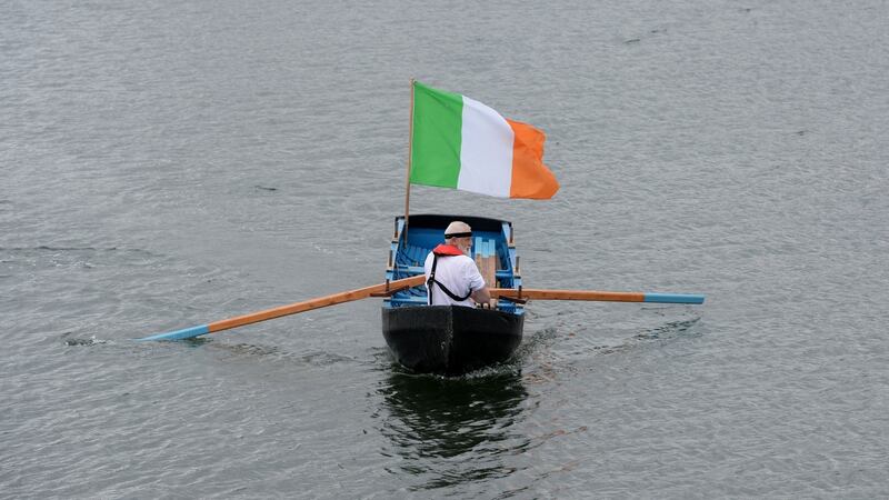 Dave Kelly pilots his currach across the Liffey after participating in a wreath-laying ceremony, organised by the Committee for the Commemoration of the Irish Famine Victims, on May 15th, 2020. Photograph: Alan Betson