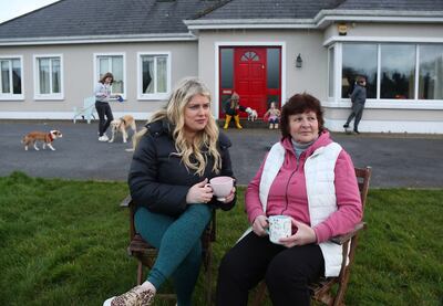 Bronwen O’Malley (left) and her Ukrainian guest Olena Kaivmova in the front garden of Bronwen's house. Photograph: Joe O’Shaughnessy