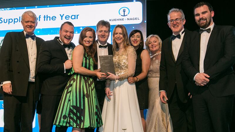 Matt Moran, Director, BioPharmaChem, presents the Pharma Supplier of the Year award to the Cora Systems team