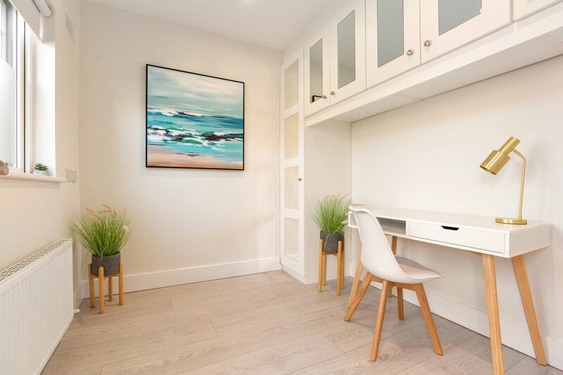 Second bedroom used as a home office with fitted units. Photograph: Angela Mujica