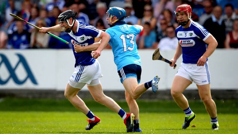 Laois’ John Lennon takes on Oisin O’Rourke of Dublin in O’Moore Park. Photograph: Inpho