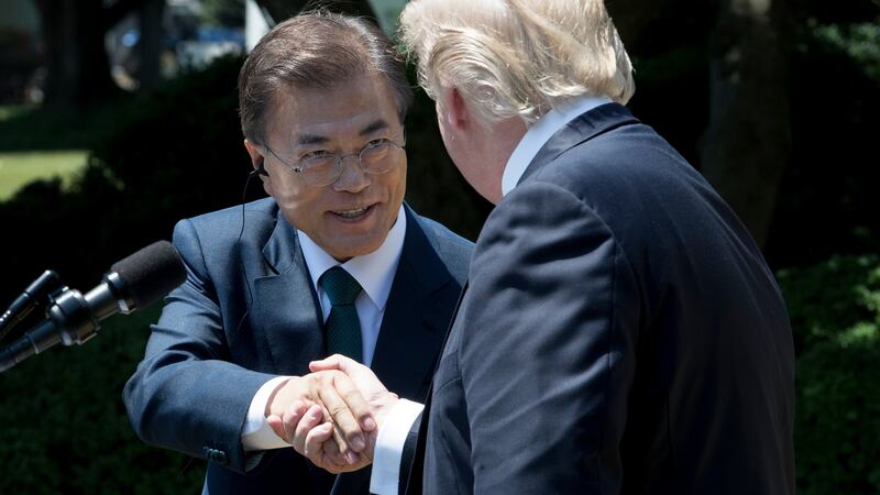 US president Donald  Trump (right) and president of South Korea Moon Jae-in shake hands while delivering joint statements in the Rose Garden of the White House in Washington at the end of June 2017. Photograph: EPA