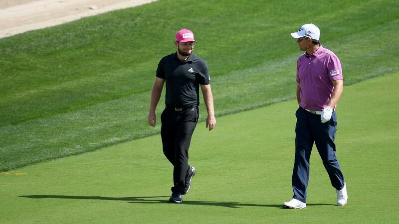 Pádraig Harrington chats to Tyrrell Hatton during the third round. Photo: Ross Kinnaird/Getty Images