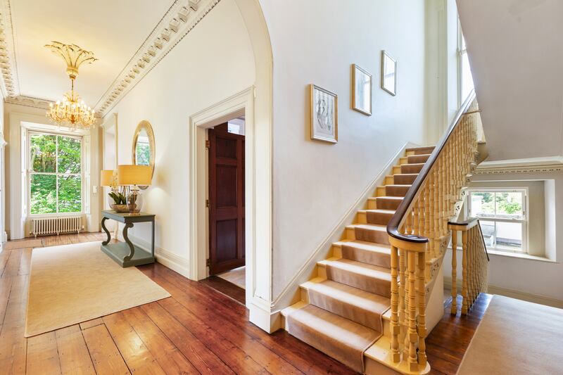 The second floor level is accessed via a sweeping staircase