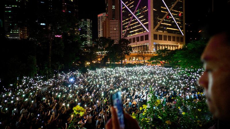 Christians gather in Chater Garden before a human chain was formed there in Hong Kong. Photograph: Anthony Wallace/AFP/Getty Images