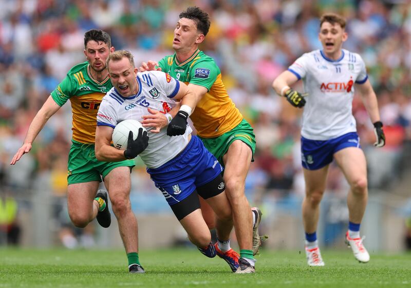 Donegal’s Ryan McHugh and Michael Langan tackle Jack McCarron of Monaghan. Photograph: James Crombie/Inpho