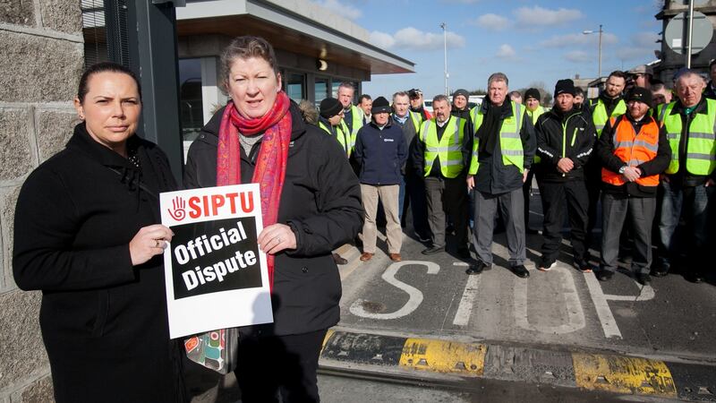 Bus Éireann workers Leona White (left) from Finglas and Ailish Delaney from Clonsilla picketing outside the Broadstone bus  depot in  Dublin as part of an indefinite all-out strike over the company’s implementation of cost-reduction measures without union agreement. Photograph: Gareth Chaney/Collins